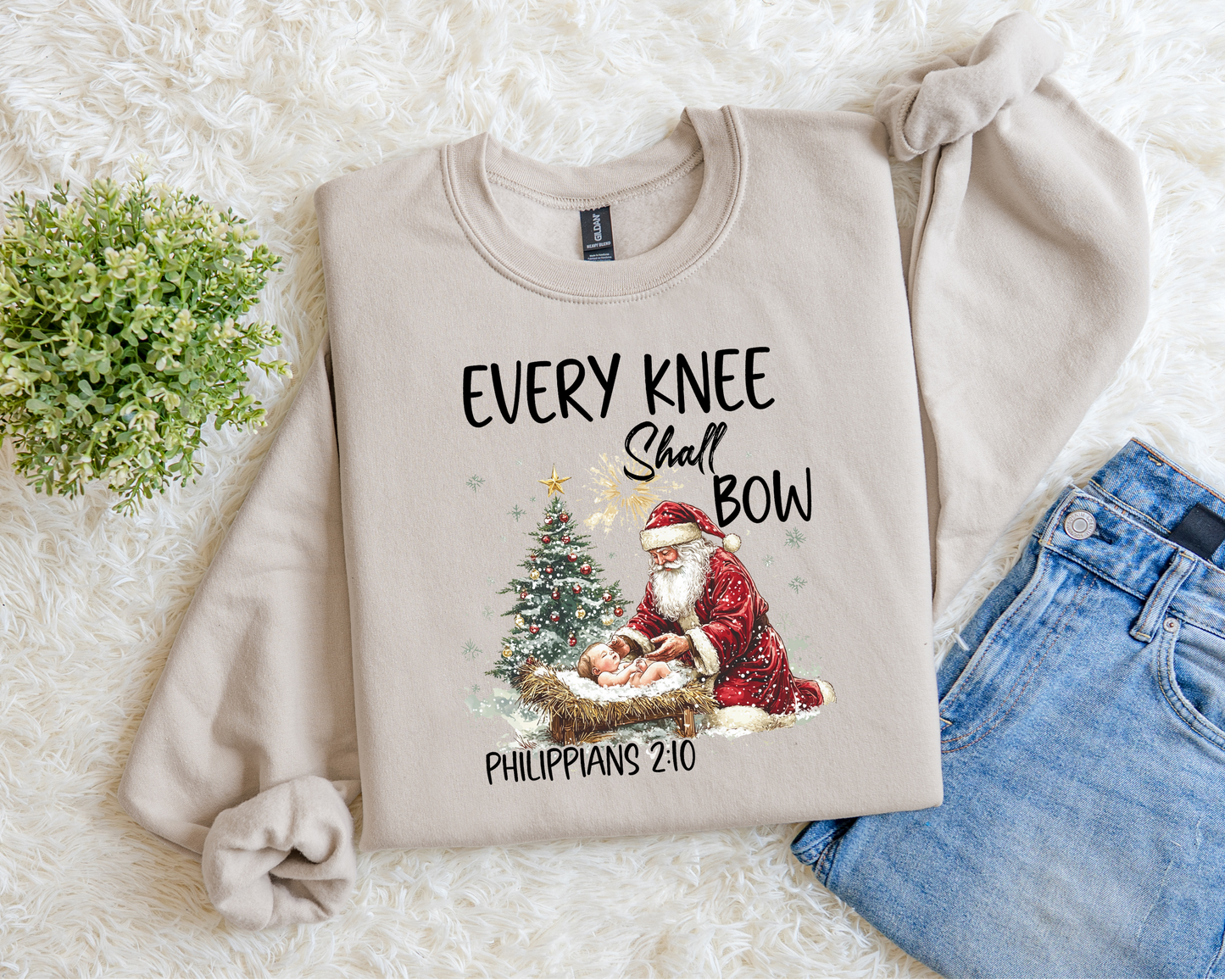 Every Knee Shall Bow (Santa And Baby Jesus) Sweatshirt.